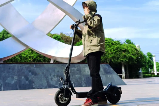 Drive Tron DT01 electric scooter riding through European city street