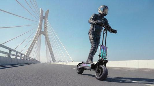 electric scooter rider travelling through a modern city street