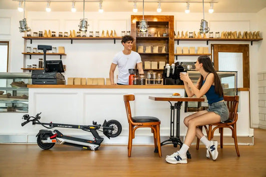 Electric scooter rider locking scooter before entering a café