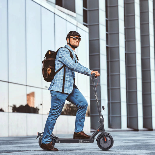 Electric scooter parked beside modern office building
